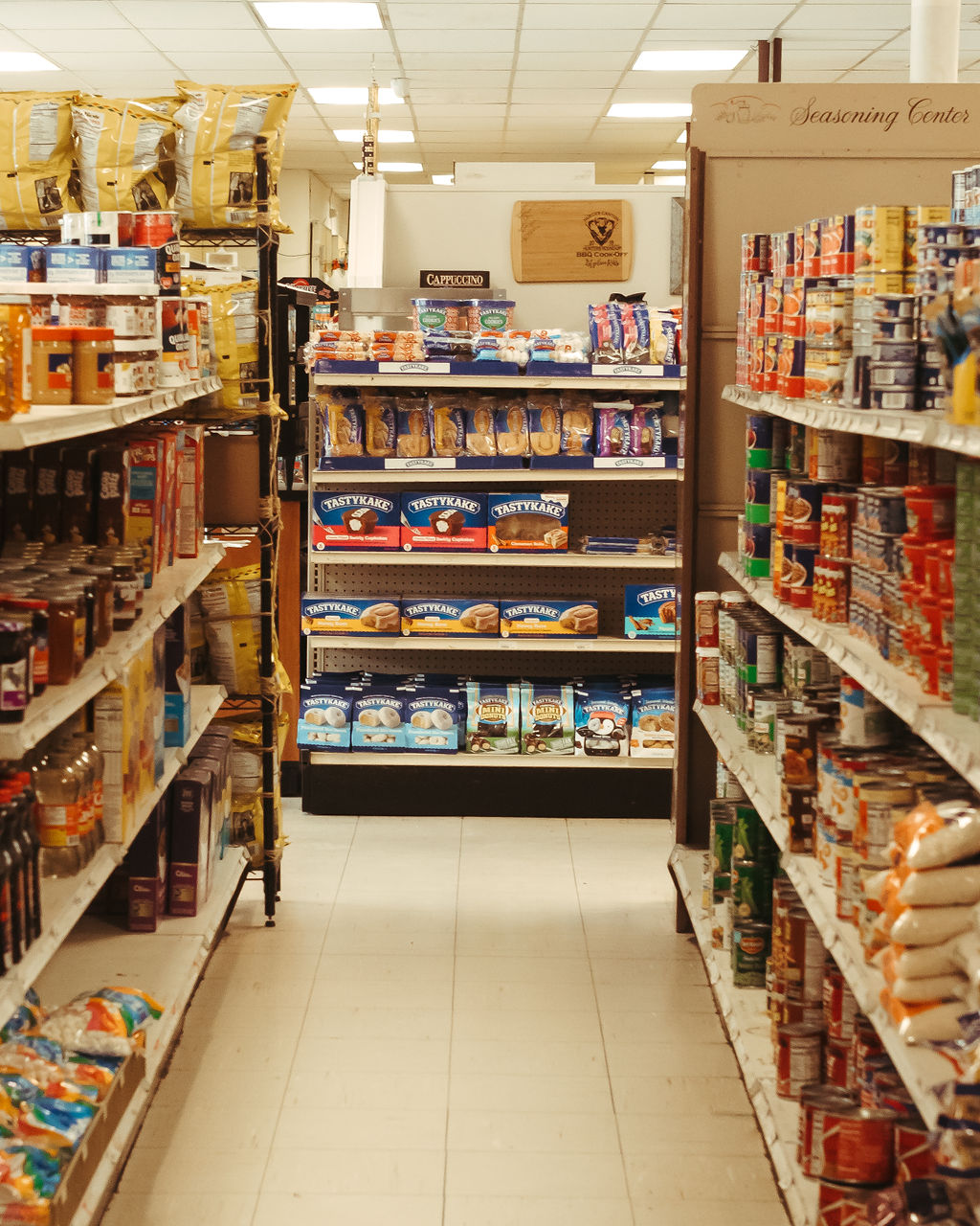Picture of a stocked grocery aisle at the getngo in campwood texas.